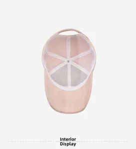 Detailed interior of pink herringbone baseball cap showing white lining and metal buckle