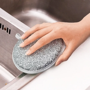 Close-up of a silver wire cleaning sponge with gray fabric border and hanging loop