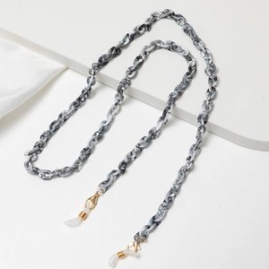 Detail of grey marble acrylic chain links with gold lobster clasp and silicone loops