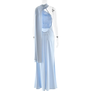 Detail of light blue backless dress with matching streamer shawl on a mannequin