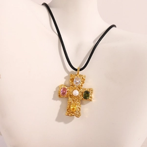 Detail of 18K gold plated hammer-textured cross pendant with colorful gems and pearl inlay
