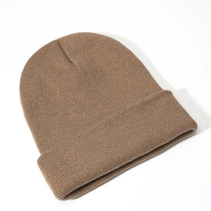 Detail of dark camel knit beanie showing fine ribbed texture and fold-over cuff design