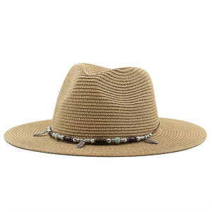 Close-up of khaki straw fedora featuring ethnic beads and a silver feather pendant