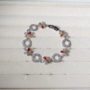 Elegant silver bracelet with colorful zircon flower petals and crystal rings for women