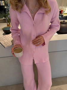 Pink knit two-piece set featuring V-neck long-sleeve top and high-waist straight-leg pants
