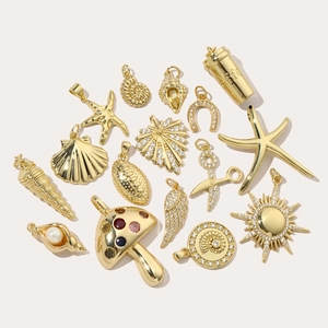 Assorted gold-plated sun, mushroom and starfish charms with cubic zirconia and pearls