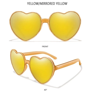Close-up of yellow heart-shaped mirrored sunglasses with transparent yellow frames