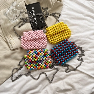 Handmade candy-colored beaded mini crossbody bags with metal chains in diverse colors
