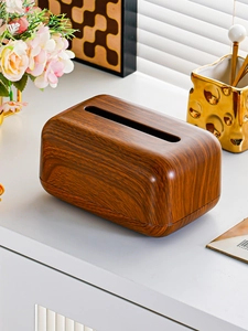 Detail of walnut wood texture tissue box with top slot opening for napkins