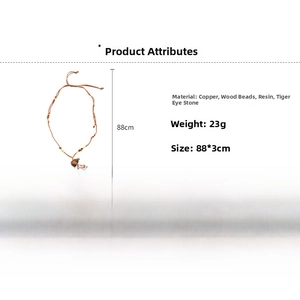 Detailed view of gourd pendant necklace with tiger eye stone and wooden beads