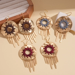 Three pairs of geometric round hollow tassel earrings with woven cord in diverse colors