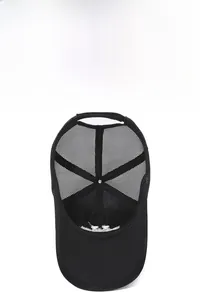 Detail of high-density breathable mesh on black trucker hat for superior ventilation