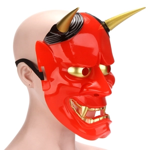 Side view of red Hannya mask with gold horns and black elastic band on model head
