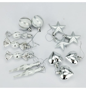 Detailed view of silver glitter and mirrored Christmas tree ornaments in various shapes