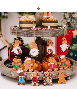 Detailed view of assorted Christmas gingerbread man and gnome wooden hanging ornaments