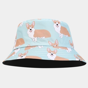 Detail of light blue bucket hat with cartoon corgi print and black reversible lining