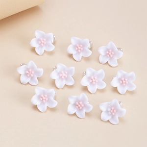 Set of ten white flower hair clips with pink centers for girls' hair styling