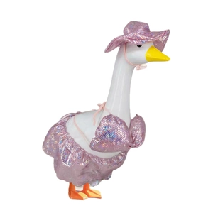 Detail of white goose statue wearing a shiny pink bikini set and matching fabric sun hat