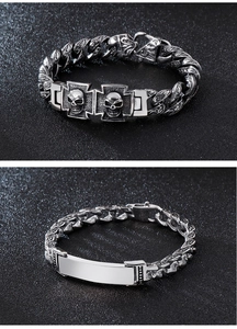 Detail of vintage 304 stainless steel skull and cross bracelets with engraved cuban links