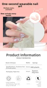 Detail of pink press-on nails with 3D crystal butterflies and ribbons in a 24pc set