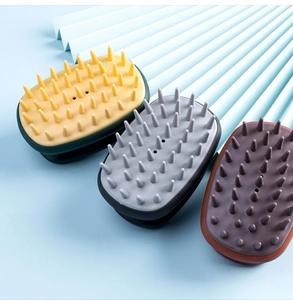 Three silicone scalp massage brushes in various colors for hair washing and deep cleaning