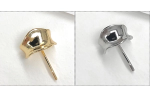 Detail showing wavy edge metal hair hooks in polished gold and silver finishes