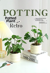 Detail of realistic artificial Monstera plant in a textured white ceramic pot with pebbles