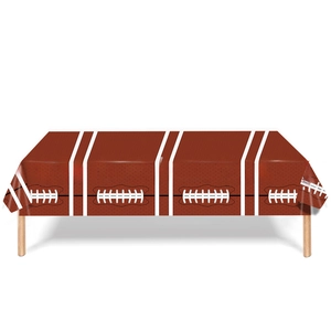 Detail view of American football themed tablecloth with brown leather texture and laces