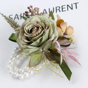 Elegant artificial rose wrist corsage with white pearl bracelet for wedding ceremony