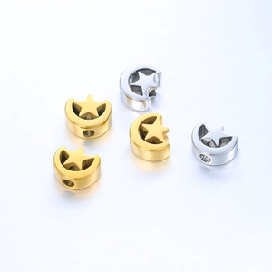 Detail of star-shaped stainless steel spacer beads in gold and silver for DIY jewelry
