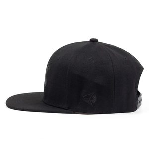 Detail of black snapback cap featuring triangle embroidery and adjustable strap closure