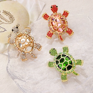 Broches tortue vintage avec cristaux facettés et strass sur monture dorée
