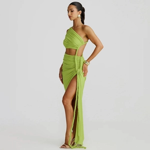 Detail of lime green one-shoulder dress with side cutout and high slit design