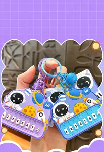 Close-up of astronaut themed rhythm piano fidget keychain with numbered buttons