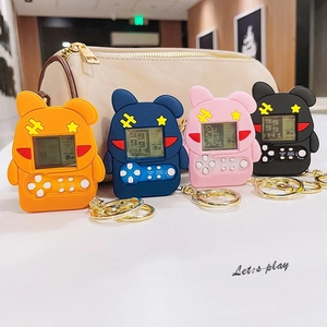 Mini retro game console keychains in four colors with screens and golden metal rings