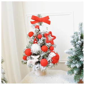 Close-up of a 45cm flocked mini Christmas tree with red ornaments and cedar wood base