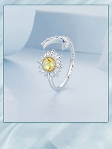 Detail of 925 sterling silver sun and moon ring with S925 hallmark and blue stones