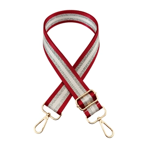 Detail of adjustable 3.8cm wide shoulder strap with red and silver metallic stripes