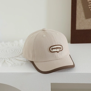 Detail of cute bear labeled baseball cap for kids with puppy embroidery and piping edge