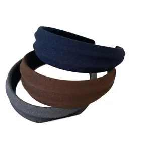 Three-color set of wide padded fabric headbands in navy, brown, and charcoal grey