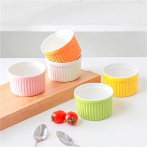 Set of 5 colorful ceramic heart-shaped bowls with vertical stripes on a wooden tray
