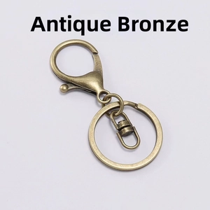 Detail of antique bronze lobster clasp set with flat key ring and connector for DIY crafts