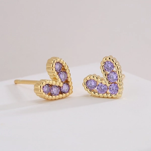 Exquisite 18K gold plated heart earrings with purple cubic zirconia stones on white surface