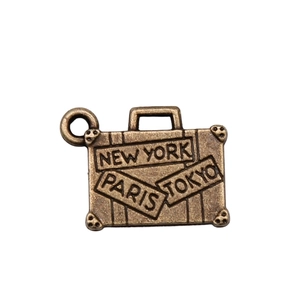 Vintage bronze suitcase pendant featuring New York, Paris, and Tokyo engravings for DIY crafts