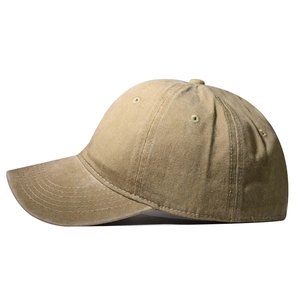 Close-up of khaki washed cotton baseball cap showing twill texture and curved brim detail