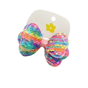 Rainbow sequin bow hair clip for girls featuring mermaid style sparkling colors