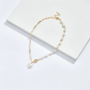 Elegant gold chain and freshwater pearl necklace with large round pearl pendant on white base