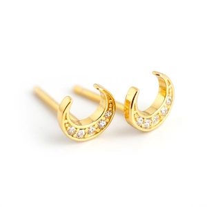 Elegant gold crescent moon stud earrings with sparkling cubic zirconia on white background