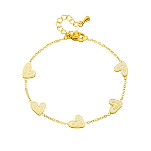 Gold chain bracelet with five white heart charms and extension chain on white background