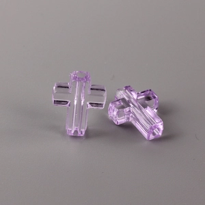 Close-up of transparent purple cross beads with center holes for DIY jewelry making